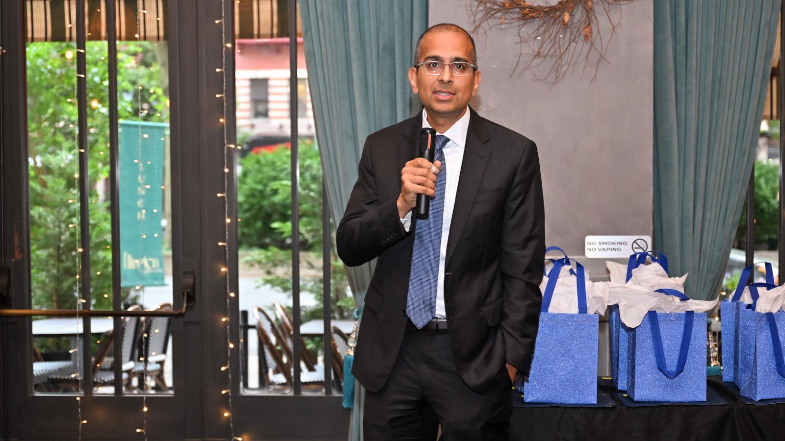 Man speaks into microphone