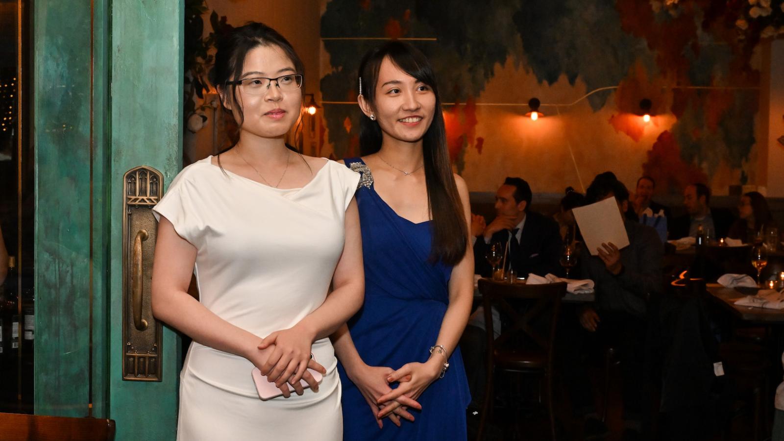 Two women standing together