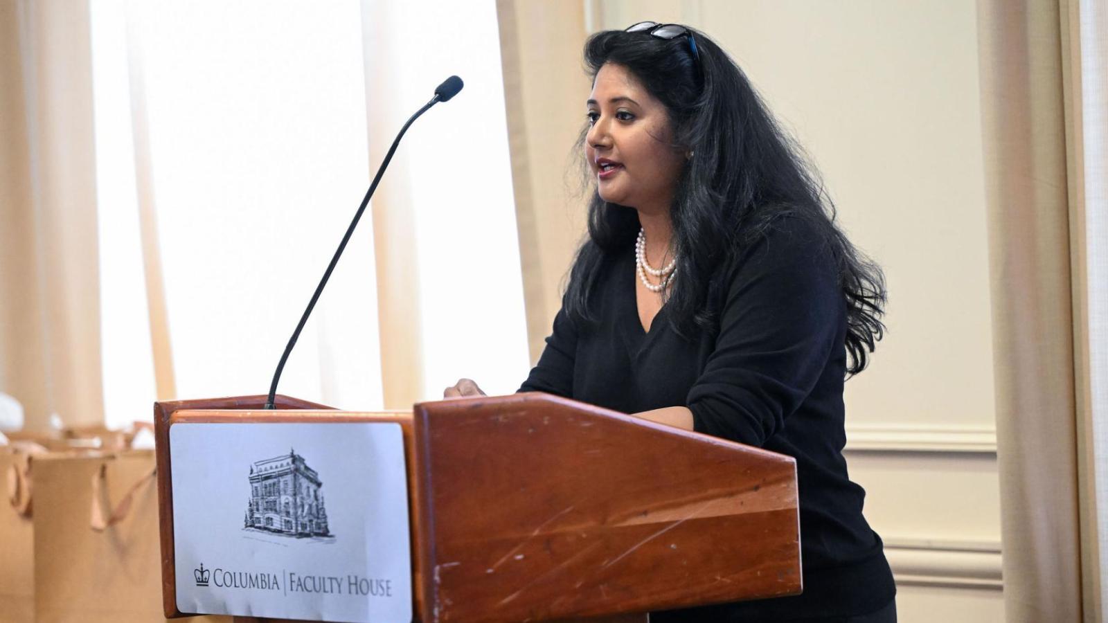 Woman speaking at podium