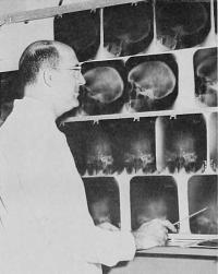 Juan Taveras, MD, looking at radiology films