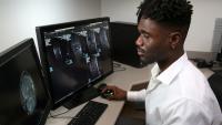 Radiology resident looks at images