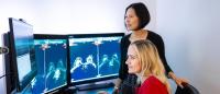 Two female radiologists looking at a screen