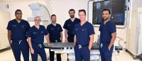 Group of physicians in an interventional radiology suite